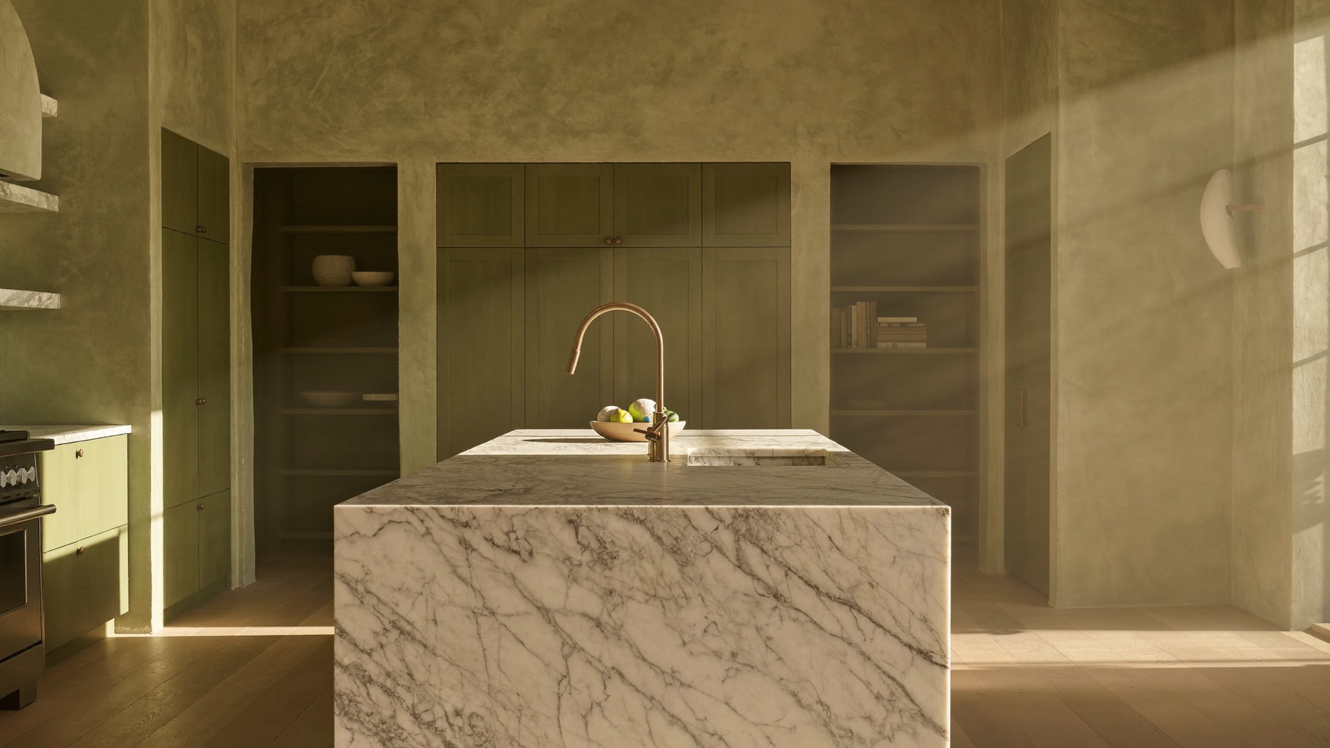 Limewash plaster kitchen with glazed-green cabinetry, a honed Calacatta marble island and an unlacquered brass faucet in long morning light, Scottsdale